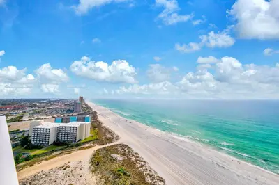 an aerial view of a beach with buildings and the ocean at Boardwalk 2101 in Panama City Beach