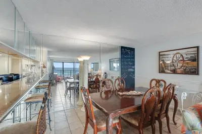 a dining room with a table and chairs at 5th Floor Oceanview Getaway - Moondrifter in Panama City Beach