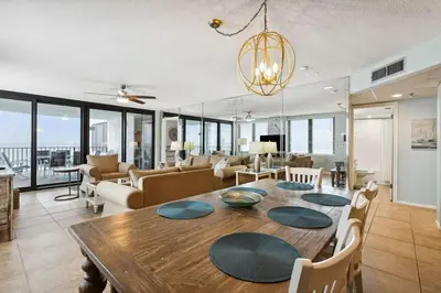 a dining room and living room with a table at Watercrest 502 - Perfect Family Getaway 2BR 2 BA in Panama City Beach