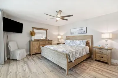 a bedroom with a bed and a ceiling fan at Watercrest 902 - Ocean Pearl Retreat - Renovated! in Panama City Beach