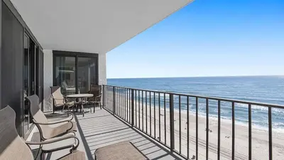 a balcony with chairs and a view of the beach at Watercrest 904 Beachfront 9th floor 3 BR 3 BA unit in Panama City Beach