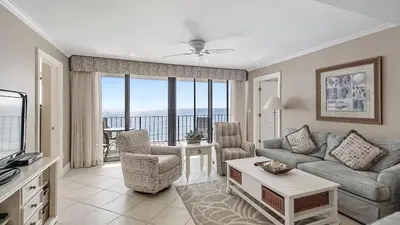 a living room with a couch and chairs and a television at Watercrest 904 Beachfront 9th floor 3 BR 3 BA unit in Panama City Beach
