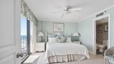 a white bedroom with a bed and a window at Watercrest 904 Beachfront 9th floor 3 BR 3 BA unit in Panama City Beach