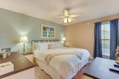 a bedroom with a bed and a ceiling fan at Walk to Beaches Resort Getaway Near Pier Park! in Panama City Beach