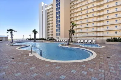 a swimming pool in front of a large building at Laketown Wharf 338 condo in Panama City Beach