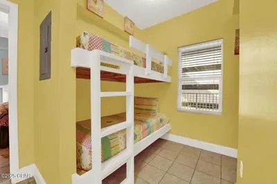 a bedroom with two bunk beds in a room at Laketown Wharf 338 condo in Panama City Beach