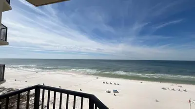 a view of a beach with people on the sand at Sunbird Resort 8th Floor Stunning Beach View - by Sunbird Rentals in Panama City Beach