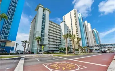 a street in a city with tall buildings at Gulf-Front Corner Unit! Stunning Coastline Views! by Dolce Vita Getaways PCB in Panama City Beach