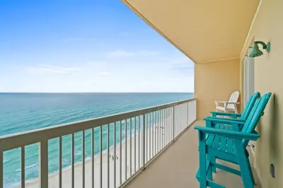 a balcony with two chairs and the ocean at Seychelles Unit 1205 in Panama City Beach