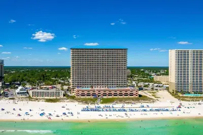 a view of a beach with buildings and people on it at 21st-Floor Sunrise Beach Gulf-Front Condo w/ Bunks & Panoramic Views in Panama City Beach