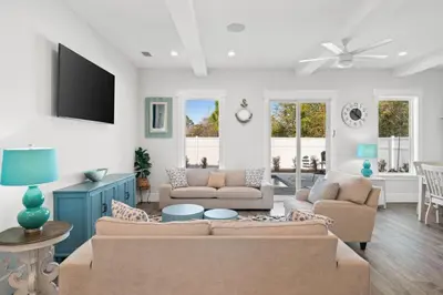 a living room with two couches and a tv at New 6BR Home Sleeps 20 | Private Pool, Walk to Beach, Near Pier Park in Panama City Beach