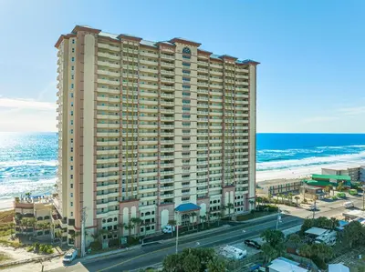 an aerial view of a large building next to the beach at Sunrise Beach 14th-Floor Gulf-Front Condo w/ Pools, Bunks & Balcony Views in Panama City Beach