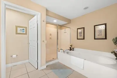 a large bathroom with a tub and a shower at Sunrise Beach 14th-Floor Gulf-Front Condo Pools, Bunks & Balcony Views in Panama City Beach