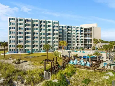 a large building with a pool and a resort at Top of the Gulf 620 Beachfront Couples Retreat in Panama City Beach