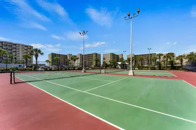 two tennis courts on a tennis court at Stunning condo in Pinnacle Port, Panama City Beach in Panama City Beach