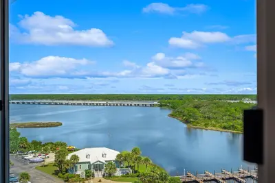 a view of a river with a bridge at Stunning condo in Pinnacle Port, Panama City Beach in Panama City Beach