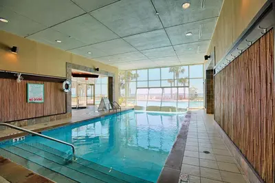 a large swimming pool in a building at Aqua Beach Resort by Panhandle Getaways in Panama City Beach