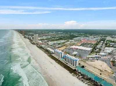 an aerial view of the beach and buildings at AquaVista Beach Resort by Panhandle Getaways in Panama City Beach