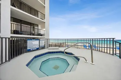 a hot tub on the balcony of a building at AquaVista Beach Resort by Panhandle Getaways in Panama City Beach