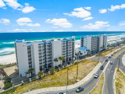 an aerial view of a building near the beach at AquaVista Beach Resort by Panhandle Getaways in Panama City Beach