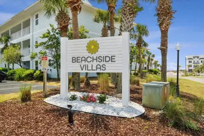 a sign for the backside villas in front of a building at Beachside Villas by Panhandle Getaways in Seagrove Beach