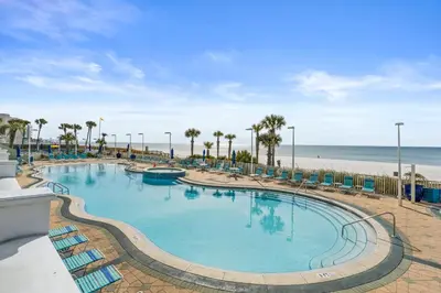 a large swimming pool next to the beach at Boardwalk Beach Resort by Panhandle Getaways in Panama City Beach