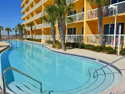 a large swimming pool in front of a hotel at Calypso Resort by Panhandle Getaways in Panama City Beach