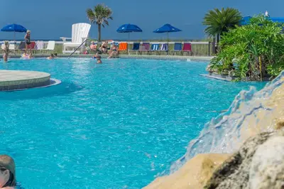 a swimming pool with water shooting up into the air at Edgewater Beach & Golf Resort by Panhandle Getaways in Panama City Beach