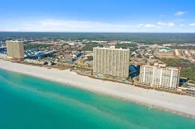 an aerial view of a beach with buildings and the ocean at Emerald Isle by Panhandle Getaways in Panama City Beach