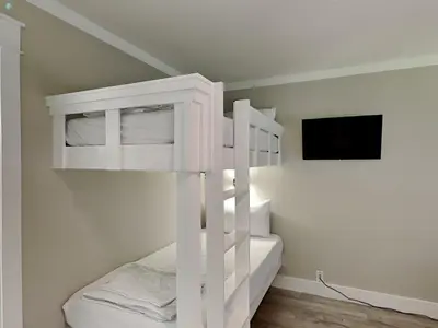 a white bunk bed in a white room at Easy on Eastern Lake in Santa Rosa Beach