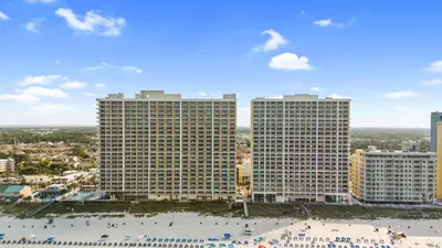 a view of two tall buildings and a beach at Majestic Beach Resort Tower I by Panhandle Getaways in Panama City Beach