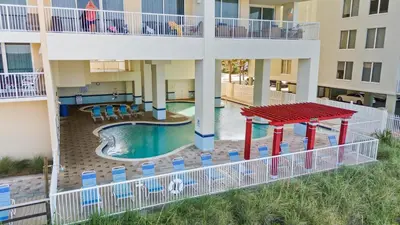an aerial view of a pool in an apartment building at Majestic Beach Resort Tower I by Panhandle Getaways in Panama City Beach