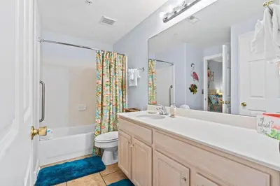 a bathroom with a sink and a toilet and a shower at Ocean Ritz by Panhandle Getaways in Panama City Beach