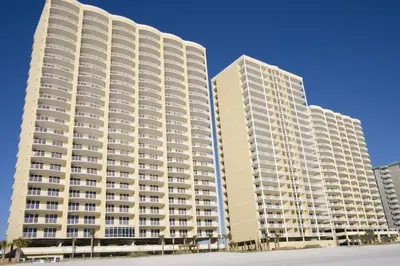 two large white buildings are next to each other at Ocean Ritz by Panhandle Getaways in Panama City Beach