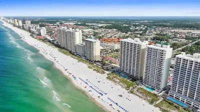 an aerial view of a beach with buildings and the ocean at Ocean Villa by Panhandle Getaways in Panama City Beach