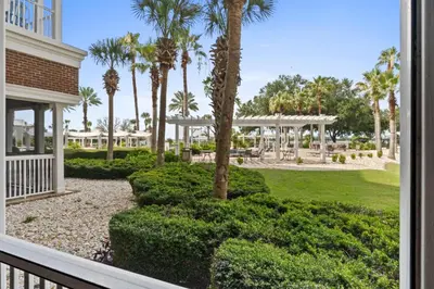 a view from a balcony of a resort with palm trees at Reflections by Panhandle Getaways in Panama City Beach