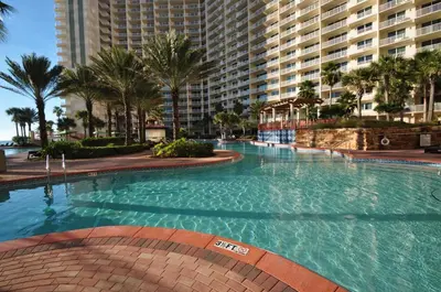 a large swimming pool in front of a large building at Shores of Panama by Panhandle Getaways in Panama City Beach