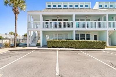 a large white house with a parking lot at Southwind by Panhandle Getaways in Panama City Beach