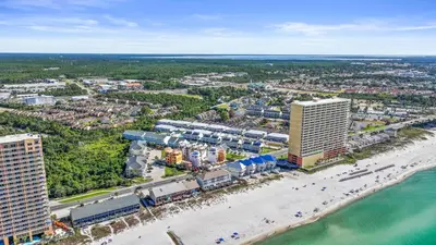 an aerial view of the beach and buildings at Southwind by Panhandle Getaways in Panama City Beach