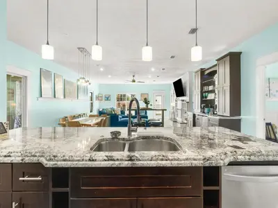 a kitchen with a sink and a counter top at Orange Crush in Panama City Beach