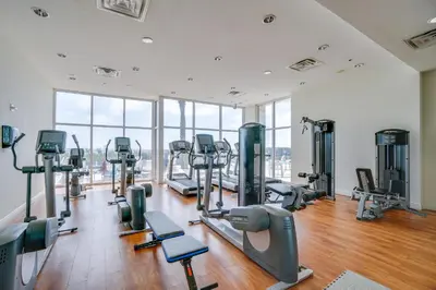 a gym with treadmills and cardio equipment in a building at Sterling Breeze by Panhandle Getaways in Panama City Beach