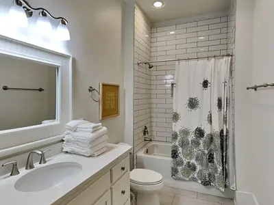 a bathroom with a sink and a toilet and a shower at Sunny Side Up in Inlet Beach
