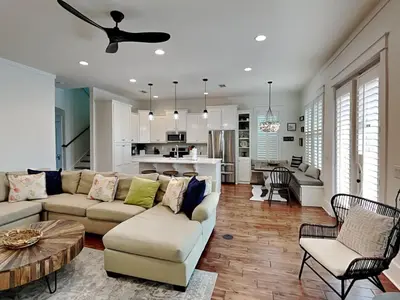 a living room with a couch and a table at Sunny Side Up in Inlet Beach