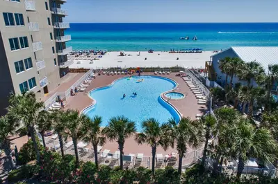 an aerial view of a swimming pool and the beach at Tidewater Beach Resort by Panhandle Getaways in Panama City Beach