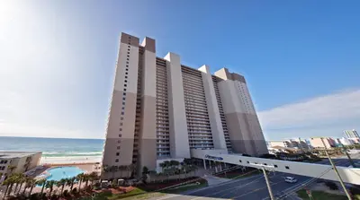 a large hotel with the ocean in the background at Tidewater Beach Resort by Panhandle Getaways in Panama City Beach