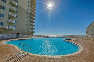 a large swimming pool in front of a building at Tidewater Beach Resort by Panhandle Getaways in Panama City Beach