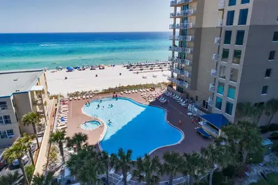 an aerial view of a resort with a swimming pool and the beach at Tidewater Beach Resort by Panhandle Getaways in Panama City Beach