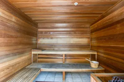 a wooden sauna with a bench in the middle at Tropic Winds Resort by Panhandle Getaways in Panama City Beach