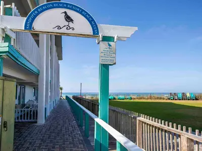 a sign outside of a building with a bird on it at Horizon South #76G in Panama City Beach
