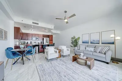 a living room with a couch and a table at Laketown Wharf 2115 Penthouse with Gulf Views in PCB - Sleeps 6 in Panama City Beach